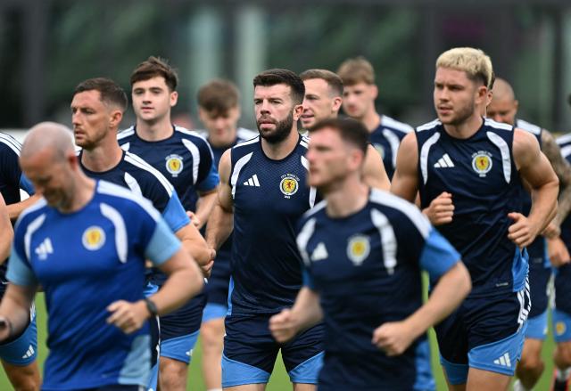 Scotland's defender #05 Grant Hanley (C) jogs with teammates during a training session at Inter Miami Stadium in Fort Lauderdale, Florida on June 23, 2026. (Photo by CHANDAN KHANNA / AFP)