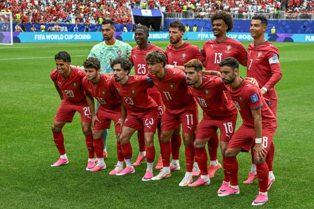 (Top L-R) Portugal's goalkeeper #01 Diogo Costa, Portugal's defender #25 Nuno Mendes, Portugal's defender #03 Ruben Dias, Portugal's midfielder #13 Renato Veiga, Portugal's forward #07 Cristiano Ronaldo, (bottom L-R) Portugal's defender #20 Joao Cancelo, Portugal's midfielder #15 Joao Neves, Portugal's midfielder #23 Vitinha, Portugal's forward #11 Joao Felix, Portugal's forward #18 Pedro Neto and Portugal's midfielder #08 Bruno Fernandes pose prior to the  2026 World Cup Group K football match between Portugal and Uzbekistan at the Houston Stadium in Houston on June 23, 2026.  (Photo by RONALDO SCHEMIDT / AFP)