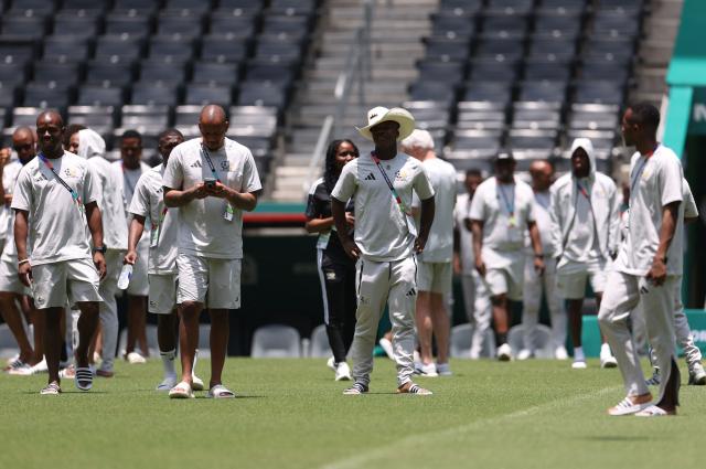 South Africa's defender #14 Mbekezeli Mbokazi (C) and teammates walk on the pitch at the Monterrey Stadium in Mexico on June 23, 2026, on the eve of the 2026 World Cup match between South Africa and South Korea. (Photo by Julio Cesar AGUILAR / AFP)