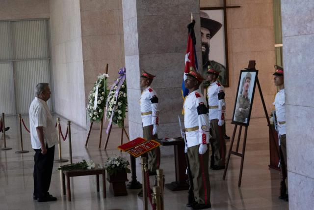 Soldiers pay tribute to the urn containing the remains of Commander Ramiro Valdes at the Ministry of the Revolutionary Armed Forces in Havana, on June 23, 2026. Ramiro Valdes Menendez, a close associate of brothers Fidel and Raul Castro and founder of the Cuban intelligence services, has died at the age of 94, Cuban President Miguel Diaz-Canel announced on June 21, 2026. (Photo by Pablo PORCIUNCULA / AFP)