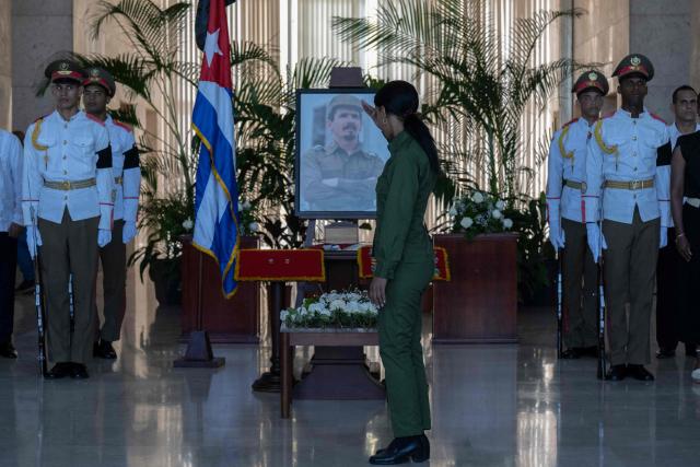 Soldiers pay tribute to the urn containing the remains of Commander Ramiro Valdes at the Ministry of the Revolutionary Armed Forces in Havana, on June 23, 2026. Ramiro Valdes Menendez, a close associate of brothers Fidel and Raul Castro and founder of the Cuban intelligence services, has died at the age of 94, Cuban President Miguel Diaz-Canel announced on June 21, 2026. (Photo by Pablo PORCIUNCULA / AFP)