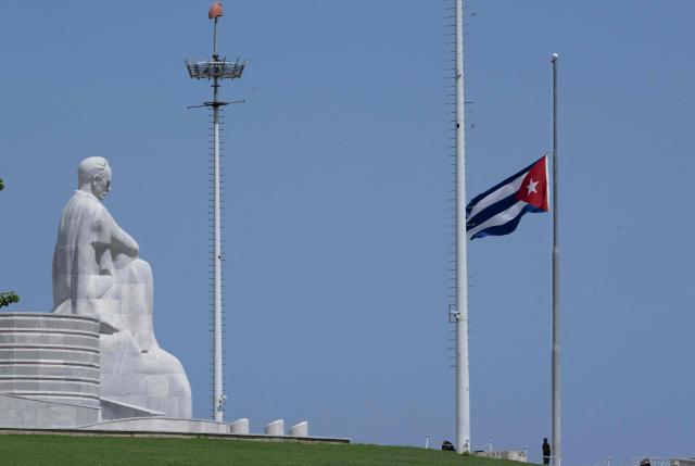 View of the Cuban flag at half-mast in front of the Jose Marti Memorial during the national mourning for the death of Commander Ramiro Valdes, in Havana, on June 23, 2026. Ramiro Valdes Menendez, a close associate of brothers Fidel and Raul Castro and founder of the Cuban intelligence services, has died at the age of 94, Cuban President Miguel Diaz-Canel announced on June 21, 2026. (Photo by Pablo PORCIUNCULA / AFP)