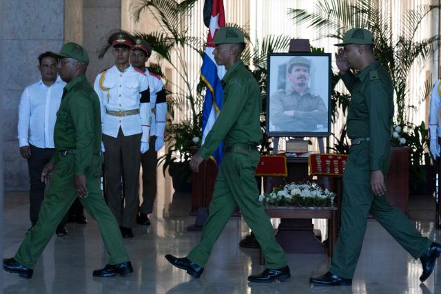 Soldiers pay tribute to the urn containing the remains of Commander Ramiro Valdes at the Ministry of the Revolutionary Armed Forces in Havana, on June 23, 2026. Ramiro Valdes Menendez, a close associate of brothers Fidel and Raul Castro and founder of the Cuban intelligence services, has died at the age of 94, Cuban President Miguel Diaz-Canel announced on June 21, 2026. (Photo by Pablo PORCIUNCULA / AFP)
