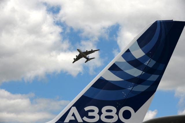 (FILES) An Airbus A380 performs a flying display at Le Bourget airport, near Paris, on June 24, 2017 during the public days the International Paris Air Show. The European Union Aviation Safety Agency (EASA) has ordered inspections of 16 Airbus A380 aircraft, including five on an urgent basis, after cracks were discovered in the wing structure of one plane, the aircraft manufacturer Airbus confirmed on June 23, 2026. (Photo by ERIC PIERMONT / AFP)