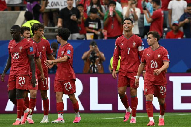 Portugal's forward #07 Cristiano Ronaldo (2nd R) celebrates after his team's fourth goal during the 2026 World Cup Group K football match between Portugal and Uzbekistan at the Houston Stadium in Houston on June 23, 2026.  (Photo by RONALDO SCHEMIDT / AFP)