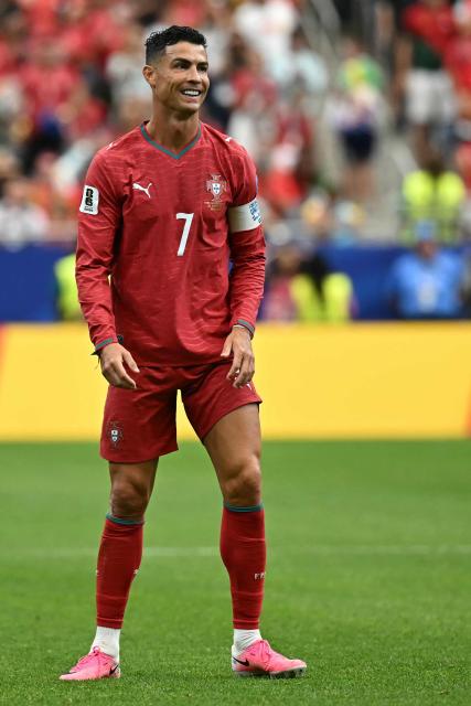 Portugal's forward #07 Cristiano Ronaldo celebrates his team's fourth goal during the 2026 World Cup Group K football match between Portugal and Uzbekistan at the Houston Stadium in Houston on June 23, 2026.  (Photo by Paul ELLIS / AFP)