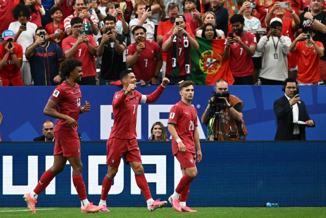 TOPSHOT - Portugal's forward #07 Cristiano Ronaldo (C) celebrates after his team's fourth goal during the 2026 World Cup Group K football match between Portugal and Uzbekistan at the Houston Stadium in Houston on June 23, 2026.  (Photo by RONALDO SCHEMIDT / AFP)