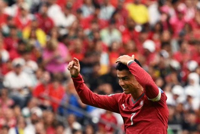 Portugal's forward #07 Cristiano Ronaldo   reacts  after his team's fourth goal during the 2026 World Cup Group K football match between Portugal and Uzbekistan at the Houston Stadium in Houston on June 23, 2026.  (Photo by RONALDO SCHEMIDT / AFP)