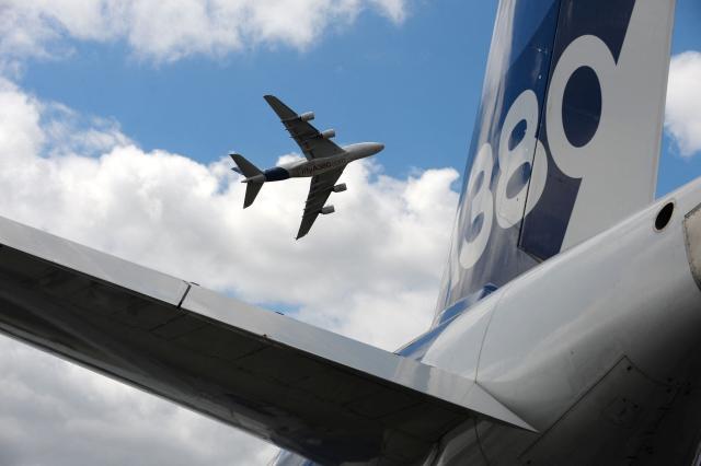 (FILES) An Airbus A380 performs a flying display at Le Bourget airport, near Paris, on June 24, 2017 during the public days the International Paris Air Show. The European Union Aviation Safety Agency (EASA) has ordered inspections of 16 Airbus A380 aircraft, including five on an urgent basis, after cracks were discovered in the wing structure of one plane, the aircraft manufacturer Airbus confirmed on June 23, 2026. (Photo by ERIC PIERMONT / AFP)