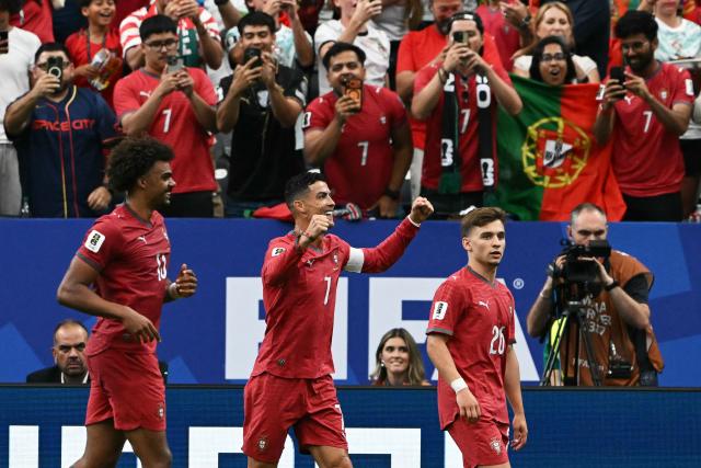 Portugal's forward #07 Cristiano Ronaldo (C) celebrates after his team's fourth goal during the 2026 World Cup Group K football match between Portugal and Uzbekistan at the Houston Stadium in Houston on June 23, 2026.  (Photo by RONALDO SCHEMIDT / AFP)