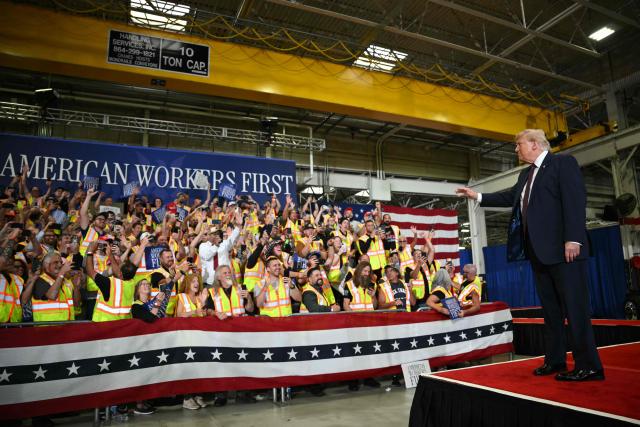 US President Donald Trump waves as he arrives to speak during a visit to the Mack Trucks manufacturing facility in Macungie, Pennsylvania, on June 23, 2026. (Photo by Mandel NGAN / AFP)