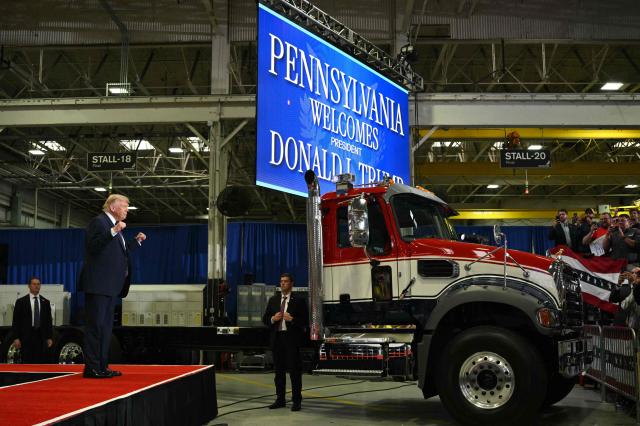 US President Donald Trump gestures as he arrives to speak during a visit to the Mack Trucks manufacturing facility in Macungie, Pennsylvania, on June 23, 2026. (Photo by Mandel NGAN / AFP)