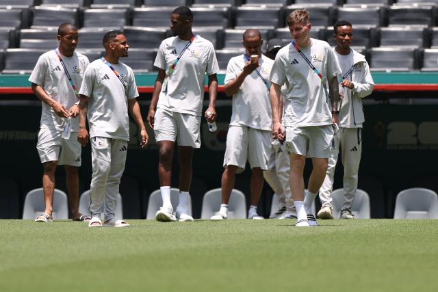 South Africa's forward #15 Iqraam Rayners (2nd L), defender #26 Bradley Cross (2nd R) midfielder #11 Themba Zwane (R) walk on the pitch at the Monterrey Stadium in Mexico on June 23, 2026, on the eve of the 2026 World Cup match between South Africa and South Korea. (Photo by Julio Cesar AGUILAR / AFP)