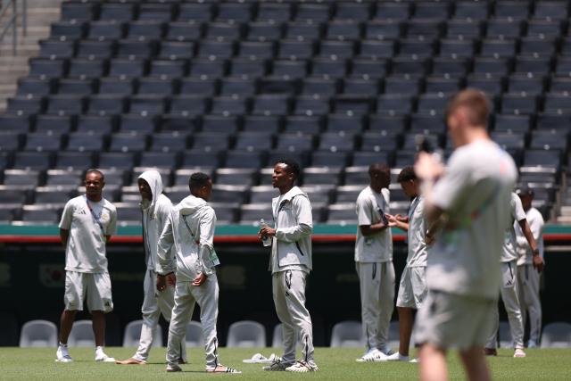 South Africa's players walk on the pitch at the Monterrey Stadium in Mexico on June 23, 2026, on the eve of the 2026 World Cup match between South Africa and South Korea. (Photo by Julio Cesar AGUILAR / AFP)