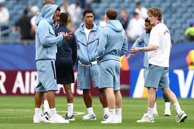 England's midfielder #10 Jude Bellingham (C) speaks with teammates on the pitch ahead of the 2026 World Cup Group L football match between England and Ghana at the Boston Stadium in Foxborough on June 23, 2026.  (Photo by CHARLY TRIBALLEAU / AFP)