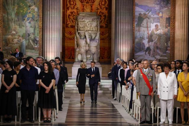 France's President Emmanuel Macron and his wife Brigitte Macron attend the Pantheon induction ceremony for the late historian and resistance fighter Marc Bloch and his wife Simonne Bloch in Paris on June 23, 2026. Historian Marc Bloch, a soldier and Resistance fighter murdered by the Gestapo, will be inducted into Frances Panthéon on June 23 in a tribute to the author of "Strange Defeat", a major work tahat President Emmanuel Macron has described as a warning against the "conformism" that undermines the "French will."
The ceremony marks the sixth Panthéon induction of Macron's two terms, following those of Simone Veil, writer Maurice Genevoix, Josephine Baker, Resistance fighter Missak Manouchian and Robert Badinter. (Photo by Alice Sacco / POOL / AFP)