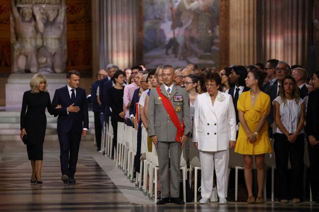 France's President Emmanuel Macron and his wife Brigitte Macron attend the Pantheon induction ceremony for the late historian and resistance fighter Marc Bloch and his wife Simonne Bloch in Paris on June 23, 2026. Historian Marc Bloch, a soldier and Resistance fighter murdered by the Gestapo, will be inducted into Frances Panthéon on June 23 in a tribute to the author of "Strange Defeat", a major work tahat President Emmanuel Macron has described as a warning against the "conformism" that undermines the "French will."
The ceremony marks the sixth Panthéon induction of Macron's two terms, following those of Simone Veil, writer Maurice Genevoix, Josephine Baker, Resistance fighter Missak Manouchian and Robert Badinter. (Photo by Alice Sacco / POOL / AFP)