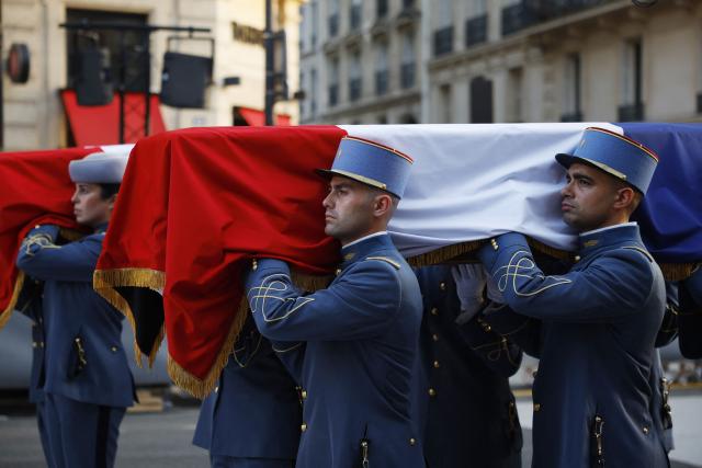 Soldiers carry the cenotaphs of the late historian and resistance fighter Marc Bloch and his wife Simonne Bloch during his Pantheon induction ceremony in Paris on June 23, 2026. Historian Marc Bloch, a soldier and Resistance fighter murdered by the Gestapo, will be inducted into Frances Panthéon on June 23 in a tribute to the author of "Strange Defeat", a major work tahat President Emmanuel Macron has described as a warning against the "conformism" that undermines the "French will."
The ceremony marks the sixth Panthéon induction of Macron's two terms, following those of Simone Veil, writer Maurice Genevoix, Josephine Baker, Resistance fighter Missak Manouchian and Robert Badinter. (Photo by Yoan VALAT / POOL / AFP)