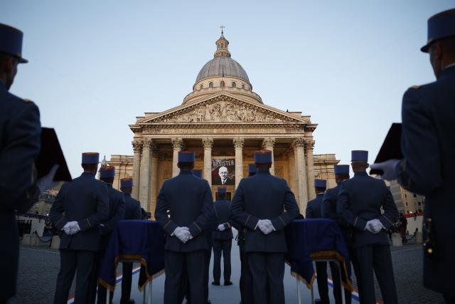 Soldiers stand by the cenotaphs of the late historian and resistance fighter Marc Bloch and his wife Simonne Bloch during his Pantheon induction ceremony in Paris on June 23, 2026. Historian Marc Bloch, a soldier and Resistance fighter murdered by the Gestapo, will be inducted into Frances Panthéon on June 23 in a tribute to the author of "Strange Defeat", a major work tahat President Emmanuel Macron has described as a warning against the "conformism" that undermines the "French will."
The ceremony marks the sixth Panthéon induction of Macron's two terms, following those of Simone Veil, writer Maurice Genevoix, Josephine Baker, Resistance fighter Missak Manouchian and Robert Badinter. (Photo by Yoan VALAT / POOL / AFP)