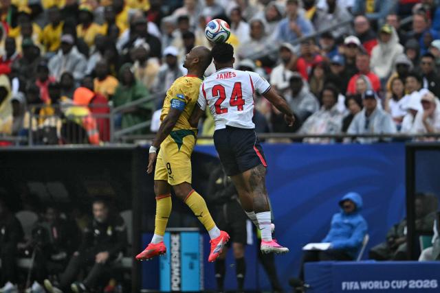 Ghana's forward #09 Jordan Ayew (L) and England's defender #24 Reece James jump for the ball  during the 2026 World Cup Group L football match between England and Ghana at the Boston Stadium in Foxborough on June 23, 2026.  (Photo by MAURO PIMENTEL / AFP)