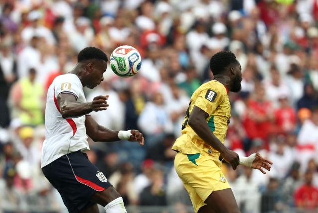 England's defender #06 Marc Guehi (L) and Ghana's forward #19 Inaki Williams jump for the ball  during the 2026 World Cup Group L football match between England and Ghana at the Boston Stadium in Foxborough on June 23, 2026.  (Photo by FRANCK FIFE / AFP)