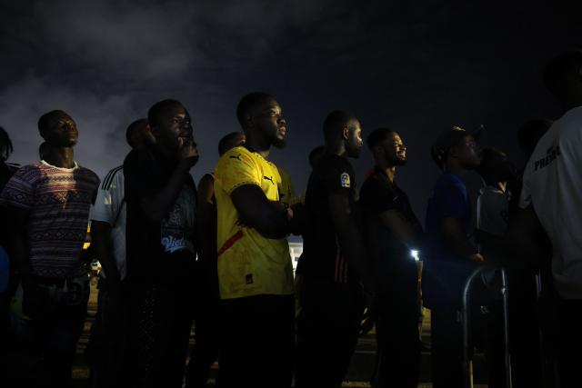 Ghanian football supporters react as they watch a live broadcast of the 2026 FIFA World Cup match between Ghana and England in Independence Square, Accra on June 23, 2026. (Photo by Nipah Dennis / AFP)