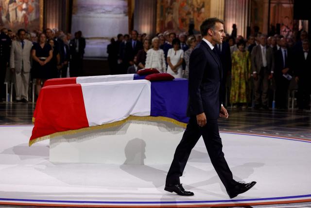France's President Emmanuel Macron pays his respects at the cenotaphs of the late historian and resistance fighter Marc Bloch and his wife Simonne Bloch during the Pantheon induction ceremony in Paris on June 23, 2026. Historian Marc Bloch, a soldier and Resistance fighter murdered by the Gestapo, will be inducted into Frances Panthéon on June 23 in a tribute to the author of "Strange Defeat", a major work tahat President Emmanuel Macron has described as a warning against the "conformism" that undermines the "French will."
The ceremony marks the sixth Panthéon induction of Macron's two terms, following those of Simone Veil, writer Maurice Genevoix, Josephine Baker, Resistance fighter Missak Manouchian and Robert Badinter. (Photo by Alice Sacco / POOL / AFP)