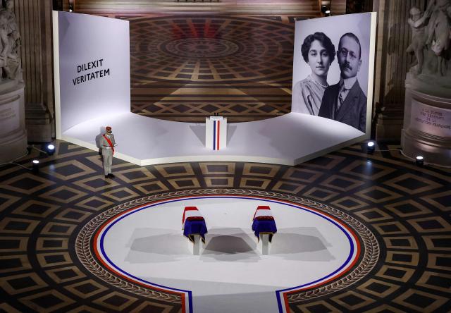 The two flag-draped cenotaphs of the late historian and resistance fighter Marc Bloch and his wife Simonne Bloch are seen in the Pantheon during the induction ceremony  in Paris on June 23, 2026. Historian Marc Bloch, a soldier and Resistance fighter murdered by the Gestapo, will be inducted into Frances Panthéon on June 23 in a tribute to the author of "Strange Defeat", a major work tahat President Emmanuel Macron has described as a warning against the "conformism" that undermines the "French will."
The ceremony marks the sixth Panthéon induction of Macron's two terms, following those of Simone Veil, writer Maurice Genevoix, Josephine Baker, Resistance fighter Missak Manouchian and Robert Badinter. (Photo by Alice Sacco / POOL / AFP)