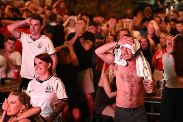 England supporters react to a late chance while watching the 2026 World Cup Group L football match between England and Ghana, at the 4TheFans Fan Park in Manchester, north-west England on June 23, 2026. (Photo by Oli SCARFF / AFP)