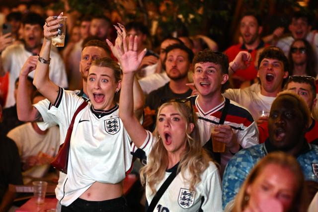 England supporters react to a late chance while watching the 2026 World Cup Group L football match between England and Ghana, at the 4TheFans Fan Park in Manchester, north-west England on June 23, 2026. (Photo by Oli SCARFF / AFP)