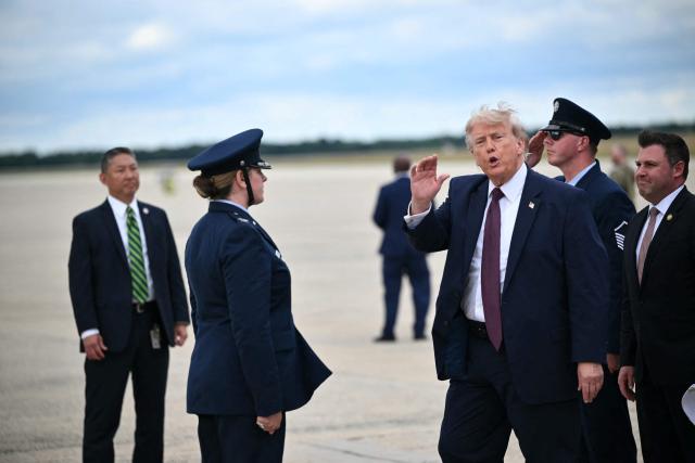 US President Donald Trump waves after stepping off Air Force One at Joint Base Andrews, Maryland, on June 23, 2026. (Photo by Mandel NGAN / AFP)