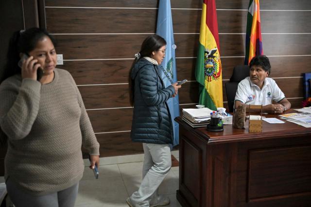 Former Bolivia's president (2006-2019) Evo Morales speaks with an assistant at his office in Lauca Ene, Tiraque province, Cochabamba department, Bolivia, on June 23, 2026. (Photo by MARTIN BERNETTI / AFP)