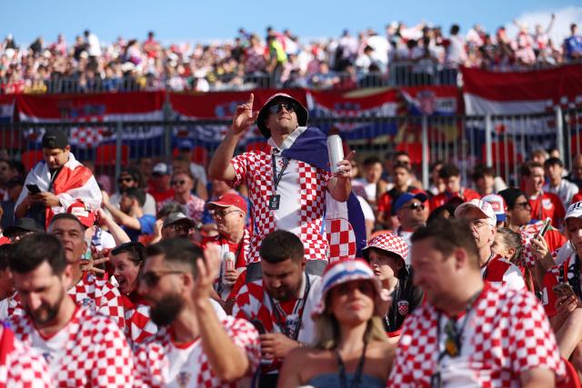 A Croatian fan cheers ahead of the 2026 World Cup Group L football match between Panama and Croatia at the Toronto Stadium in Toronto on June 23, 2026.  (Photo by Cole Burston / AFP)