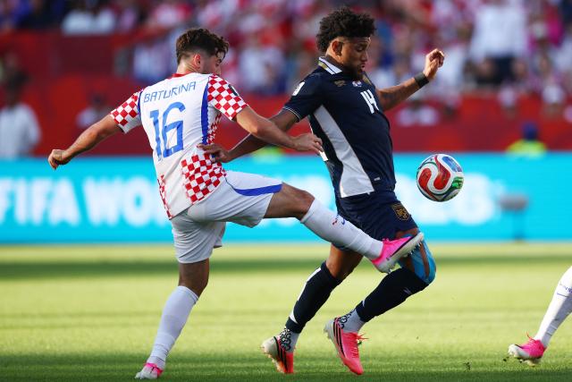 Croatia's midfielder #16 Martin Baturina and Panama's midfielder #14 Carlos Harvey fight for the ball during the 2026 World Cup Group L football match between Panama and Croatia at the Toronto Stadium in Toronto on June 23, 2026.  (Photo by Cole Burston / AFP)