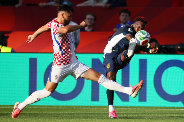 Croatia's defender #06 Josip Sutalo and Panama's midfielder #07 Jose Luis Rodriguez fight for the ball during the 2026 World Cup Group L football match between Panama and Croatia at the Toronto Stadium in Toronto on June 23, 2026.  (Photo by Cole Burston / AFP)