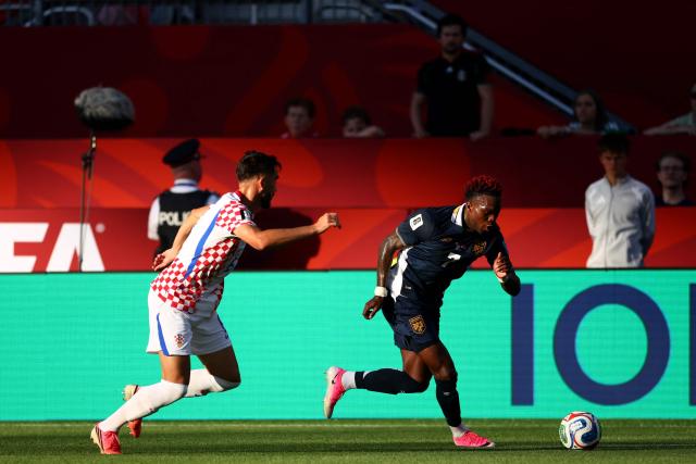 Croatia's defender #06 Josip Sutalo and Panama's midfielder #07 Jose Luis Rodriguez fight for the ball during the 2026 World Cup Group L football match between Panama and Croatia at the Toronto Stadium in Toronto on June 23, 2026.  (Photo by Cole Burston / AFP)