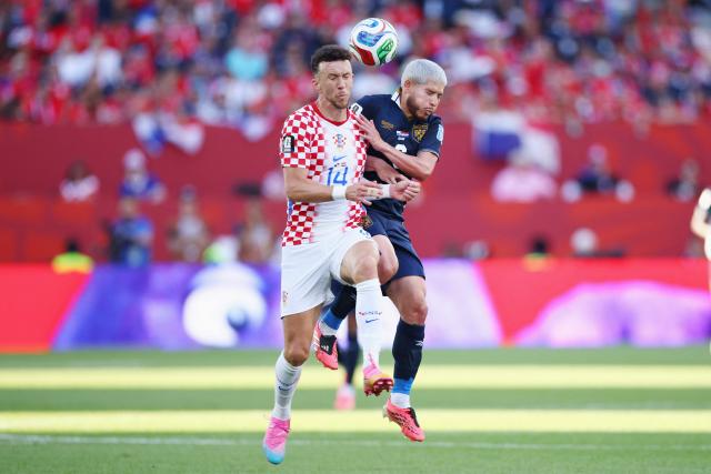 Croatia's forward #14 Ivan Perisic and Panama's midfielder #06 Cristian Martinez fight for the ball during the 2026 World Cup Group L football match between Panama and Croatia at the Toronto Stadium in Toronto on June 23, 2026.  (Photo by Cole Burston / AFP)
