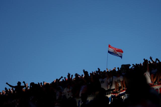 A Croatian fan waves a national flag during the 2026 World Cup Group L football match between Panama and Croatia at the Toronto Stadium in Toronto on June 23, 2026.  (Photo by Cole Burston / AFP)