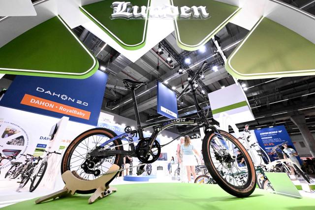 A foldable bike is seen at the booth of Dahon at the EUROBIKE 2026 fair of the international bicycle industry in Frankfurt am Main, western Germany on June 24, 2026. According to the organisers, more than 1,500 exhibitors of the bicycle and ecomobility industry from 60 countries will present their products and services during the fair running from June 24 to June 27, 2026. (Photo by Kirill KUDRYAVTSEV / AFP)