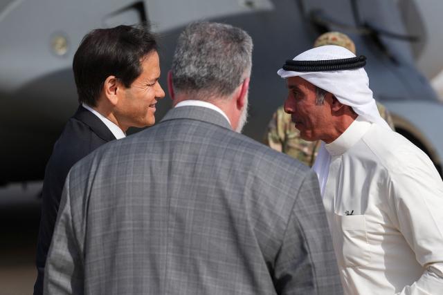 US Secretary of State Marco Rubio is greeted by Kuwait's Deputy Foreign Minister Hamad Suleiman Mashaan Al-Mashaan (R) as Steven Butler, charge d'affaires ad interim of the US Embassy in Kuwait looks on, after arriving on a US Air Force C-17 Globemaster III transport aircraft at Kuwait International Airport during his visit to the Middle East to discuss the interim deal between the US and Iran with Arab Gulf allies, in Kuwait City on June 24, 2026. Rubio arrived in the United Arab Emirates on June 23, and held talks with its leader flying to Kuwait and then Bahrain, where he will attend a Gulf Cooperation Council (GCC) meeting. Rubio's trip is the first by a senior US official to the Middle East since the Iran agreement was signed last week. (Photo by Eric Lee / POOL / AFP)