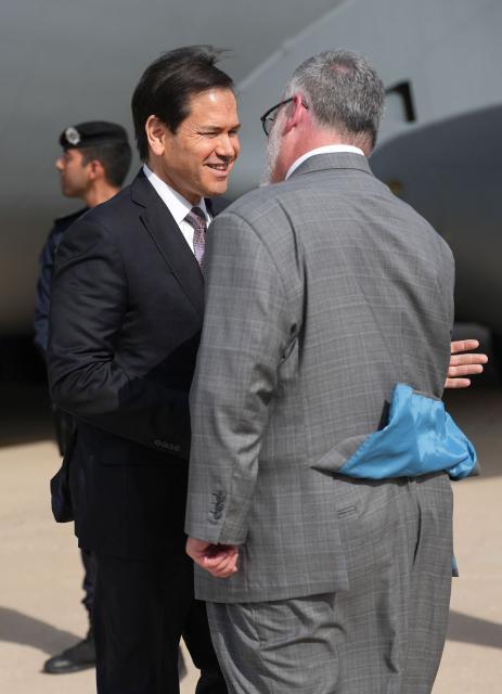 US Secretary of State Marco Rubio is greeted by Steven Butler, charge d'affaires ad interim of the US embassy in Kuwait, after arriving on a US Air Force C-17 Globemaster III transport aircraft at Kuwait International Airport during his visit to the Middle East to discuss the interim deal between the US and Iran with Arab Gulf allies, in Kuwait City on June 24, 2026. Rubio arrived in the United Arab Emirates on June 23, and held talks with its leader flying to Kuwait and then Bahrain, where he will attend a Gulf Cooperation Council (GCC) meeting. Rubio's trip is the first by a senior US official to the Middle East since the Iran agreement was signed last week. (Photo by Eric Lee / POOL / AFP)