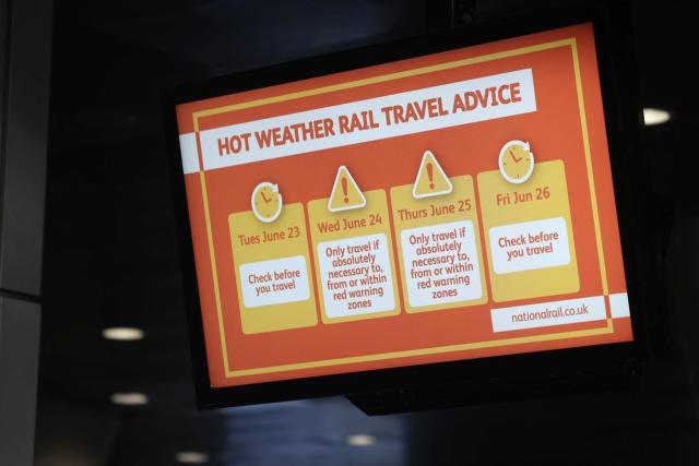 A sign shows hot weather travel advice at Kings Cross station in central London on June 24, 2026. The UK's meteorological office has issued an extremely rare red heat warning -- only issued once before -- for June24 and 25, as temperatures could soar to 40C, unprecedented for the time of the year. (Photo by Toby Shepheard / AFP)