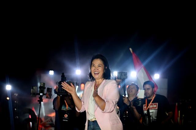 (FILES) Peru's presidential candidate Keiko Fujimori, for the Fuerza Popular party, dances during her closing campaign rally at Villa el Salvador in Lima on April 9, 2026. Right-wing presidential candidate Keiko Fujimori appeared to get an unassailable lead as the victor on late June 23, 2026, in Peru's presidential runoff election vote count. With 99.86 percent of ballots tallied, Fujimori had 50.12 percent of the June 7 vote, a margin of just over 43,000 over her leftist opponent Roberto Sanchez, with an estimated 39,300 votes remaining, according to the National Office of Electoral Processes (ONPE). Keiko Fujimori has run for the nation's presidency three elections in a row -- and three times, she has lost. But on this, her fourth attempt, she is on the verge of winning. (Photo by ERNESTO BENAVIDES / AFP)