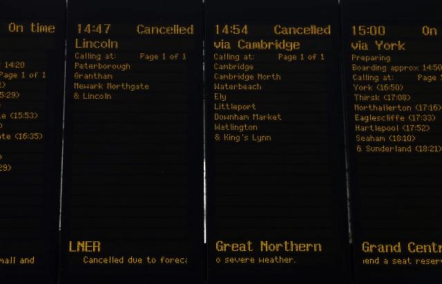 Departure board's show cancelled trains at Kings Cross station in central London on June 24, 2026. The UK's meteorological office has issued an extremely rare red heat warning -- only issued once before -- for June24 and 25, as temperatures could soar to 40C, unprecedented for the time of the year. (Photo by Toby Shepheard / AFP)