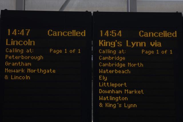 Departure board's show cancelled trains at Kings Cross station in central London on June 24, 2026. The UK's meteorological office has issued an extremely rare red heat warning -- only issued once before -- for June24 and 25, as temperatures could soar to 40C, unprecedented for the time of the year. (Photo by Toby Shepheard / AFP)