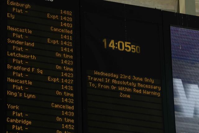 A sign shows travel advice at Kings Cross station in central London on June 24, 2026. The UK's meteorological office has issued an extremely rare red heat warning -- only issued once before -- for June24 and 25, as temperatures could soar to 40C, unprecedented for the time of the year. (Photo by Toby Shepheard / AFP)