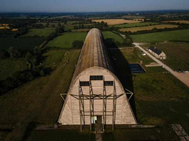 This aerial photograph taken on June 24, 2026 shows the Ecausseville's airship hangar, in Ecausseville, western France. (Photo by Lou BENOIST / AFP)