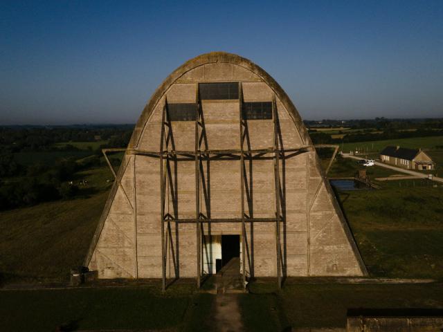 This aerial photograph taken on June 24, 2026 shows the Ecausseville's airship hangar, in Ecausseville, western France. (Photo by Lou BENOIST / AFP)
