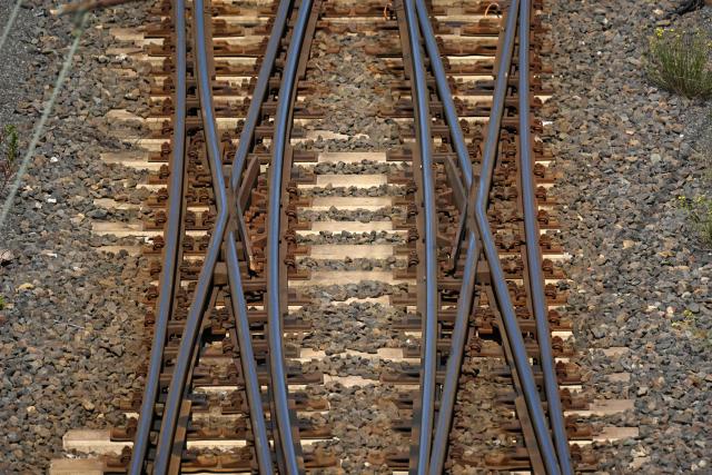 Railway tracks of German railway operator Deutsche Bahn DB are seen at the freight station in Hagen, western Germany on June 24, 2026, the day after a breakdown in the railway radio communication system brought trains across the country to a standstill. A disruption in the digital radio network temporarily brought rail traffic across Germany to a standstill overnight. In addition to long-distance and regional services, private rail operators and S-Bahn (suburban rail) services in various cities were also affected. On June 24, the company stated that train services in Germany had resumed "largely without disruption" that morning. However, "isolated disruptions may still occur." Passengers are advised to check their connections. (Photo by Ina FASSBENDER / AFP)