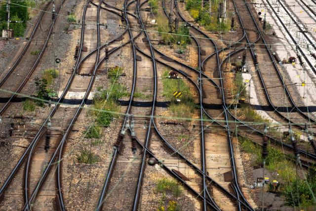 Railway tracks of German railway operator Deutsche Bahn DB are seen at the freight station in Hagen, western Germany on June 24, 2026, the day after a breakdown in the railway radio communication system brought trains across the country to a standstill. A disruption in the digital radio network temporarily brought rail traffic across Germany to a standstill overnight. In addition to long-distance and regional services, private rail operators and S-Bahn (suburban rail) services in various cities were also affected. On June 24, the company stated that train services in Germany had resumed "largely without disruption" that morning. However, "isolated disruptions may still occur." Passengers are advised to check their connections. (Photo by Ina FASSBENDER / AFP)